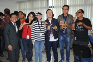 Associates at Kompas Cyber Media enjoy a casual chat and coffee break